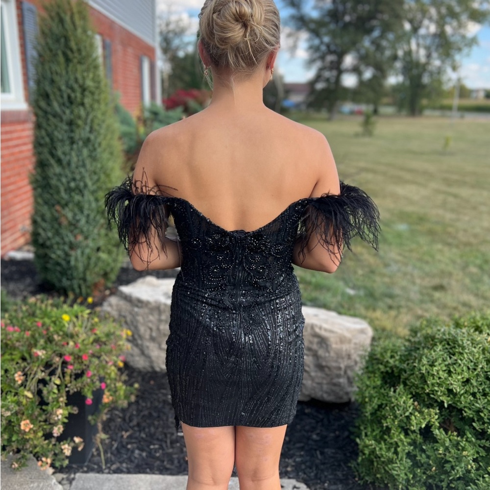 black, off the shoulders, dress. Sequins and lace, low back. Worn one time.